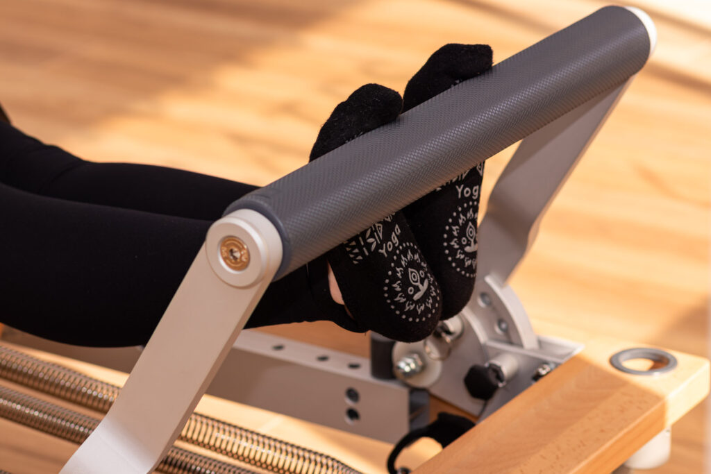 une footbar sur le reformer de pilates 